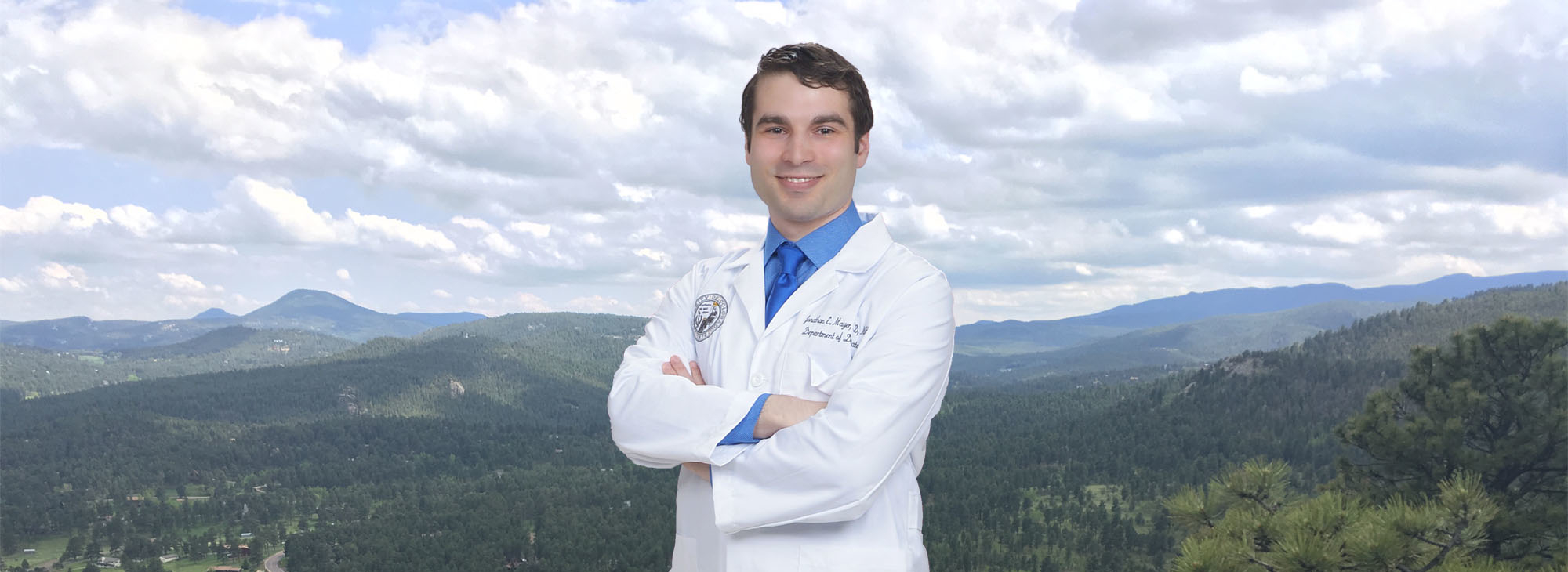 Dr. Mayer in front of mountains